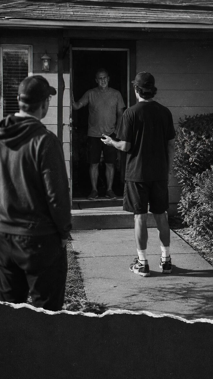 A NUERA representative talking with a homeowner at their front door
